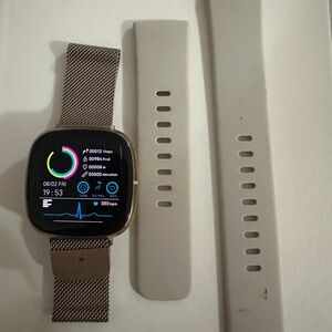 Fitbit Smartwatch with Silver and White Bands
